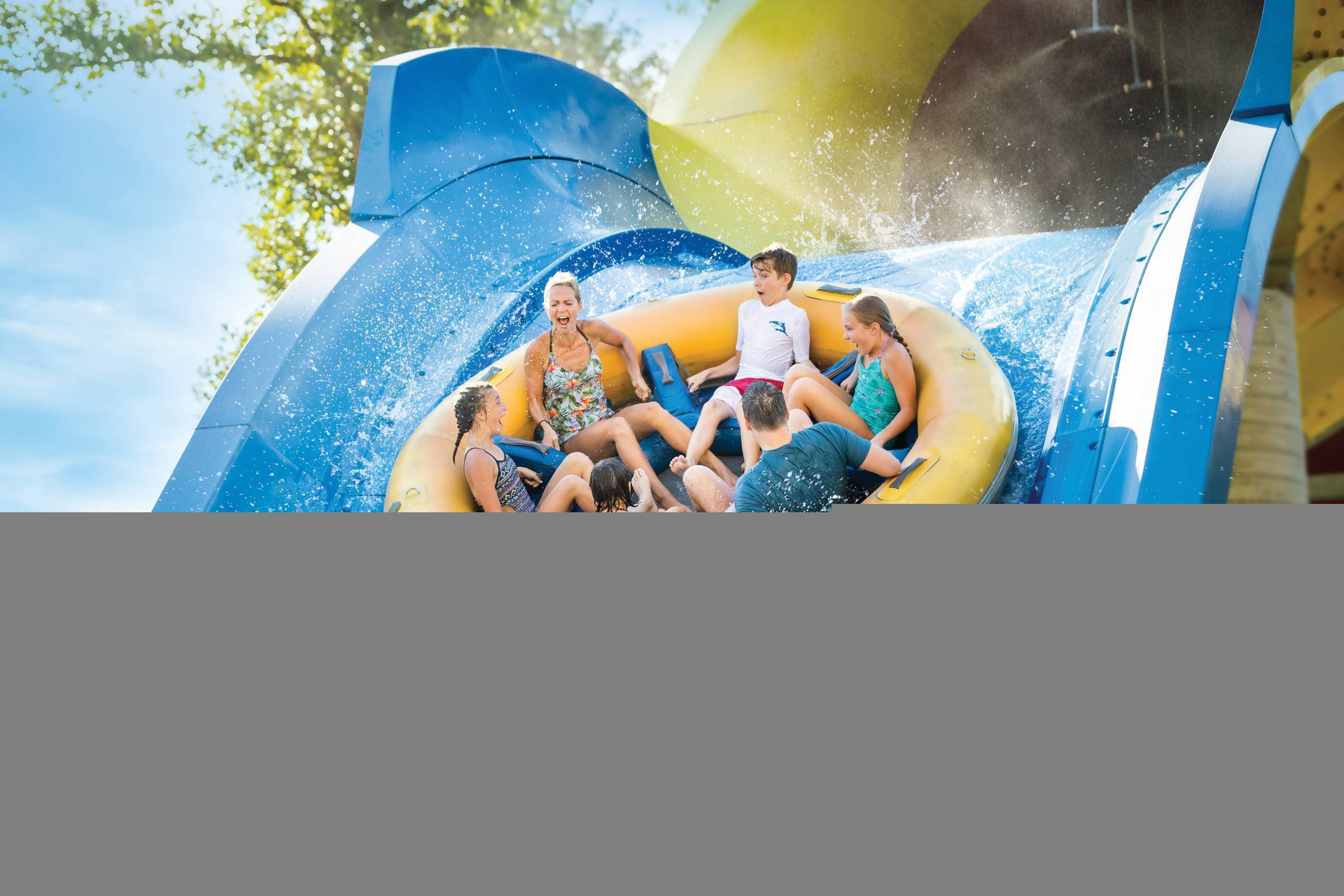 Family screaming while going down the steepest drop of Mammoth Water Coaster at Holiday World & Splashin' Safari in Santa Claus, Indiana