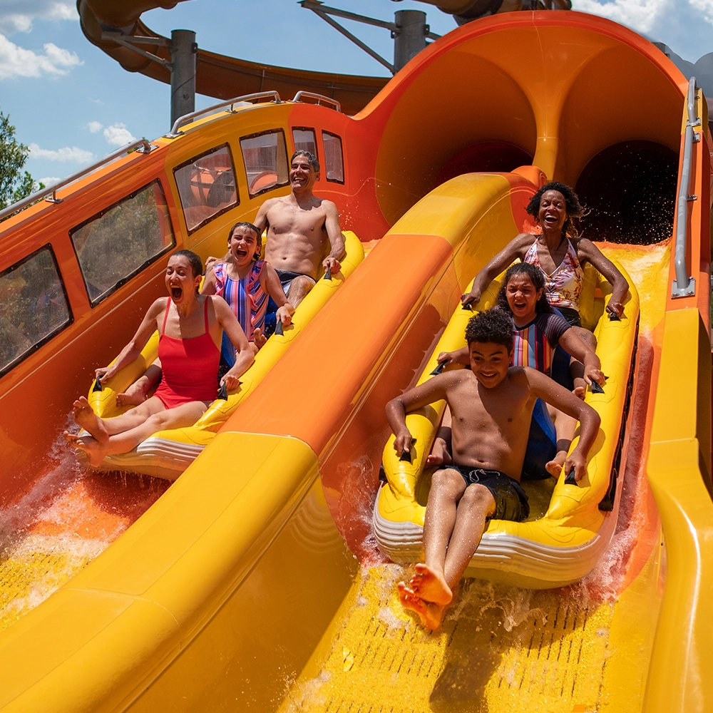 Boats racing side-by-side on Cheetah Chase Water Coaster at Holiday World & Splashin' Safari in Santa Claus, Indiana.